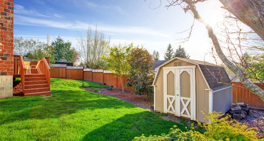 Fenced backyard with storage shed in Morgantown